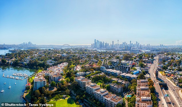 Real estate agents are charging more for the same amount of work, experts say (an aerial shot of Rozelle, in Sydney's inner west is pictured)