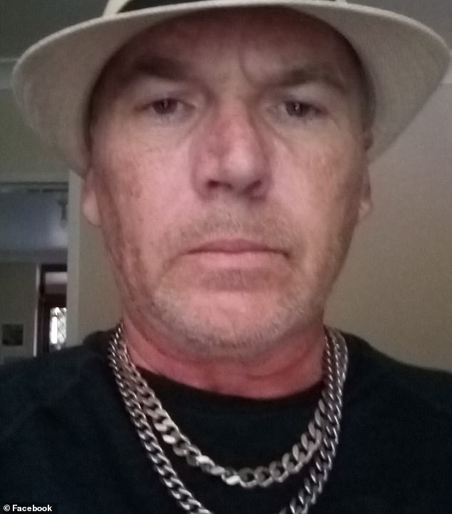 Andrew Cambouris (pictured) terrorised his neighbours with a fake gun and anti-Semitic rants for several weeks