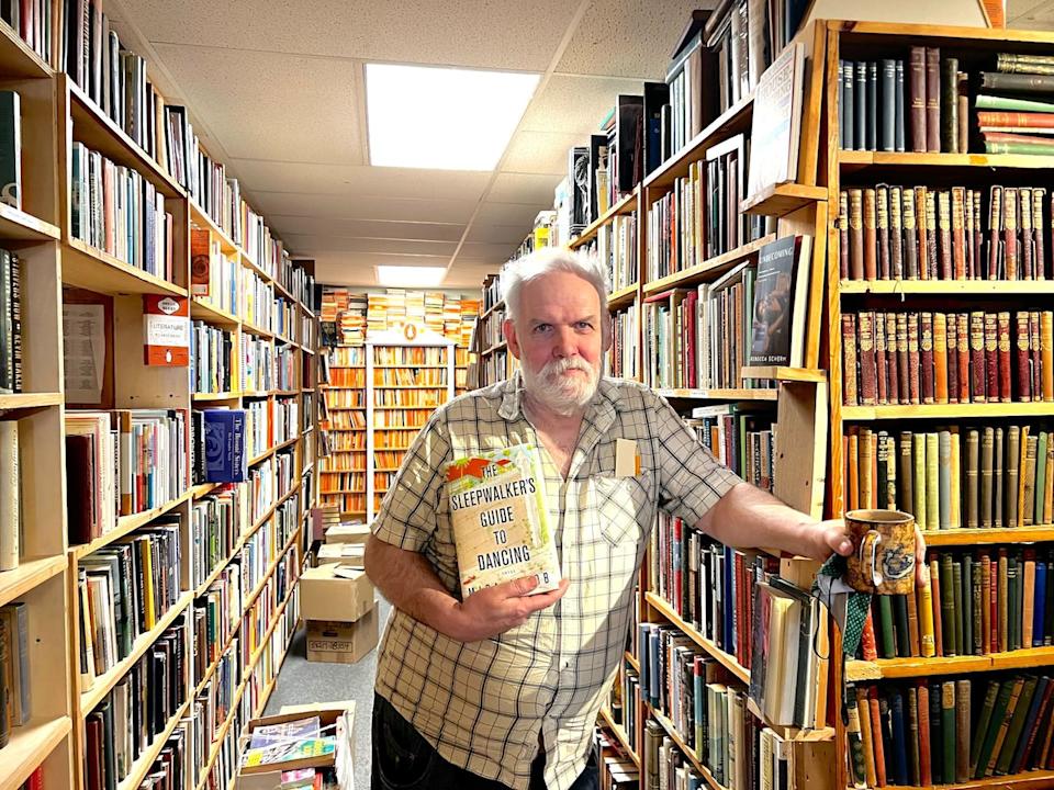 John Doull's store on Main Street in Dartmouth is filled with all sorts of treasures for the bibliomaniac. 