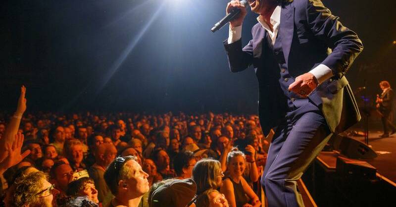A UK charity shop has been swamped with fans after Nick Cave dropped off books from his collection. Photo: AP PHOTO