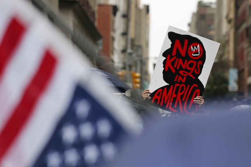 Demonstrators march down Fifth Avenue during the
