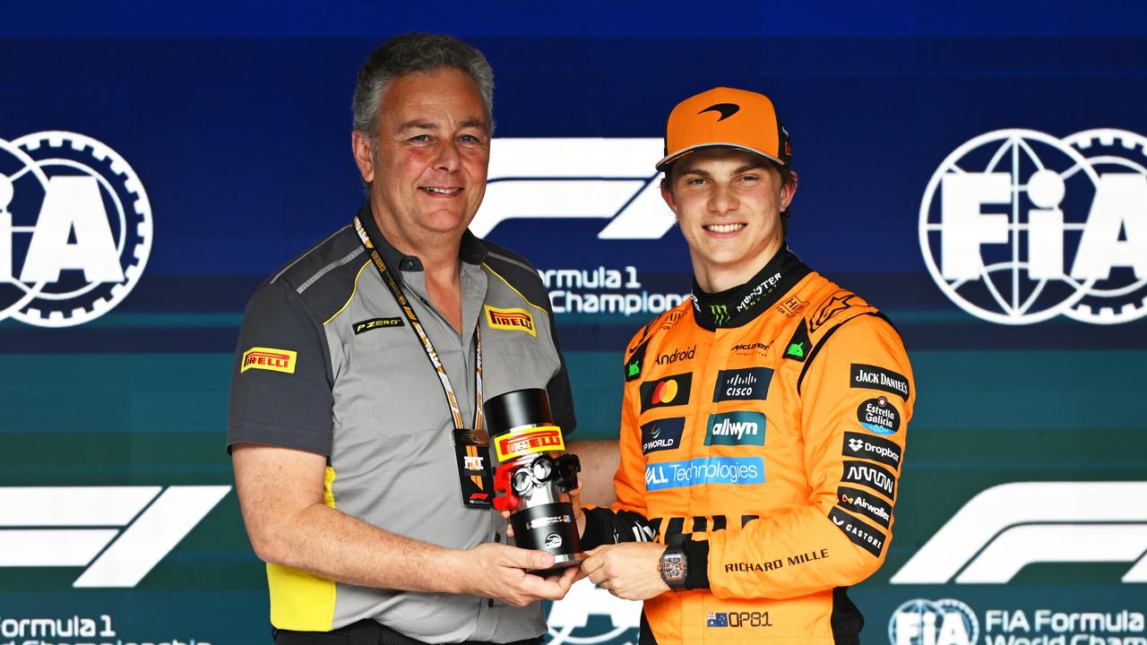 Mario Isola, Director of Pirelli F1 presents Sprint Pole qualifier Oscar Piastri of Australia and McLaren with his Pirelli Sprint Pole award.