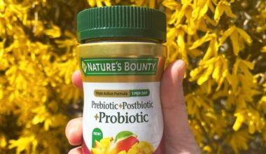 A hand holding a bottle of Nature's Bounty supplements