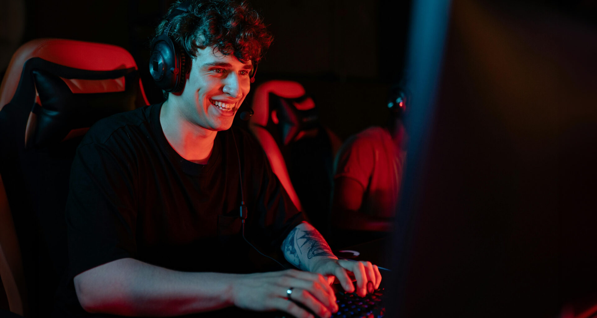 Man wearing headphones at computer desk