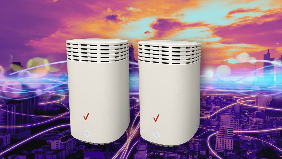 Two routers sit next to each other on a multicolor background