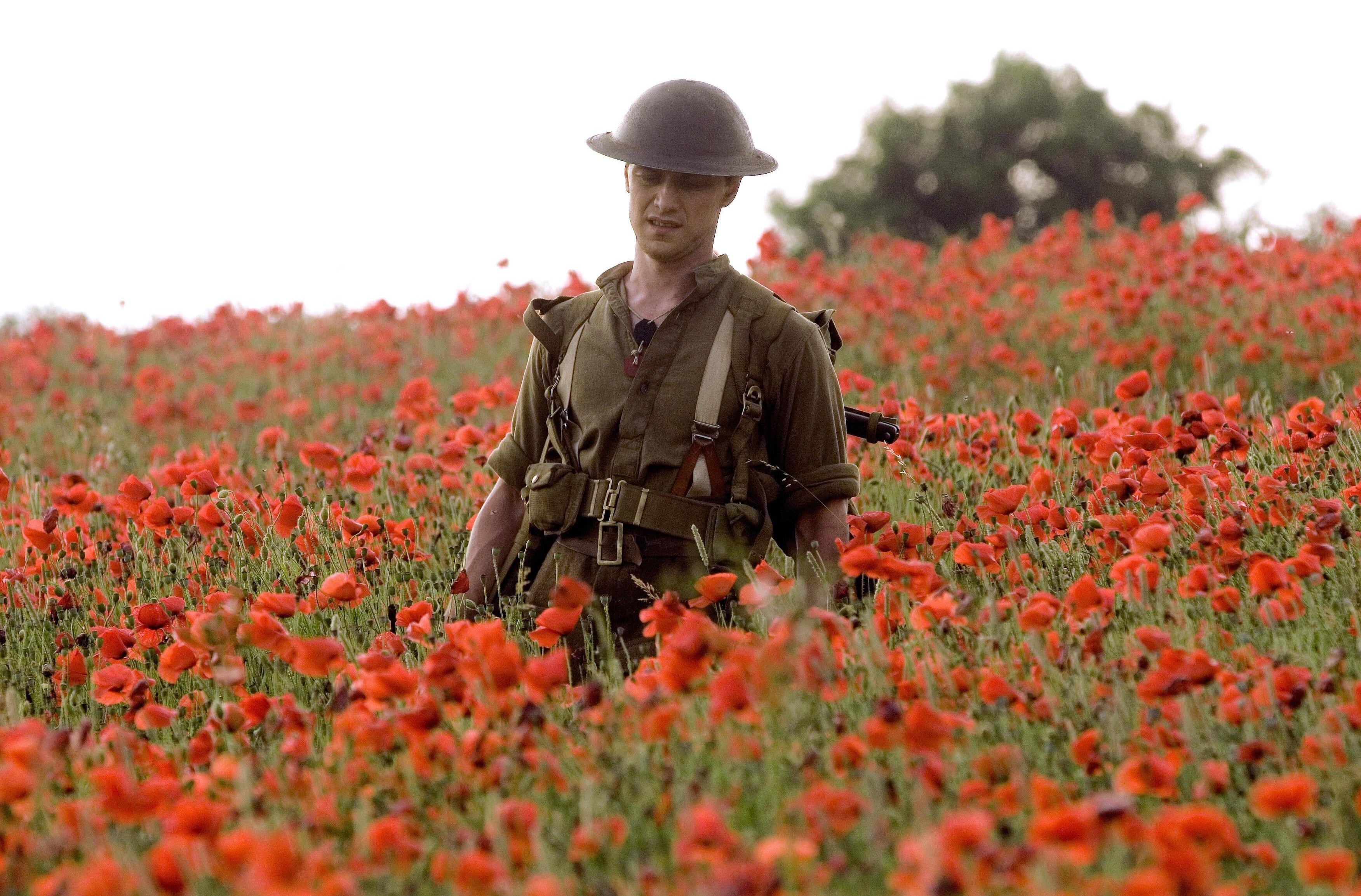 James McAvoy in a poppy field in *Atonement*.