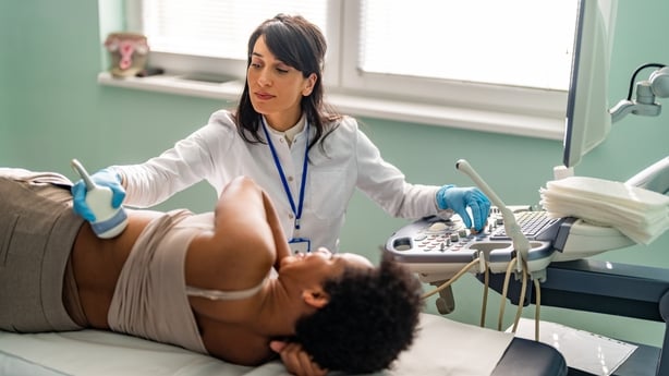 Doctor conducting ultrasound examination
