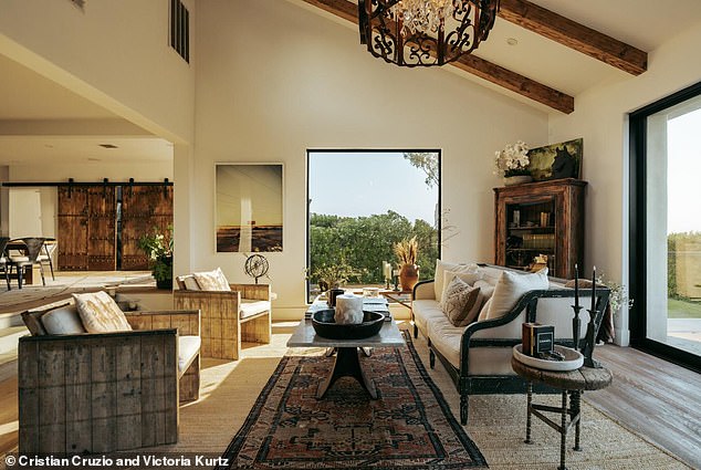 The living room is a step down with large windows