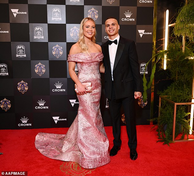 Hill and Georgia Devlin (pictured at last year's Brownlow Medal ceremony) left a string of clues about their break-up on social media