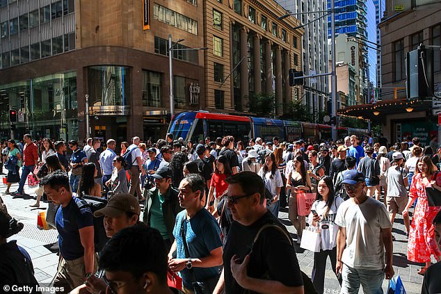Australia's reliance on low-skilled migrants during a time of low unemployment appears to have backfired, with the nation's productivity crisis worsening (pictured are Sydney pedestrians)