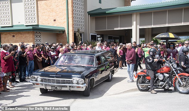 Mourners wore maroon at the request of Backo's family, filling the funeral service with State of Origin pride