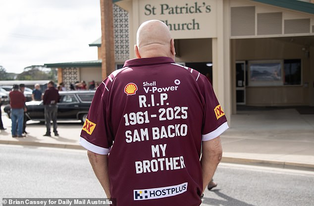 Mourners wearing shirts emblazoned with 'Slammin' Sam Backo' and striking Origin images reflected his fierce playing days and Queensland heritage