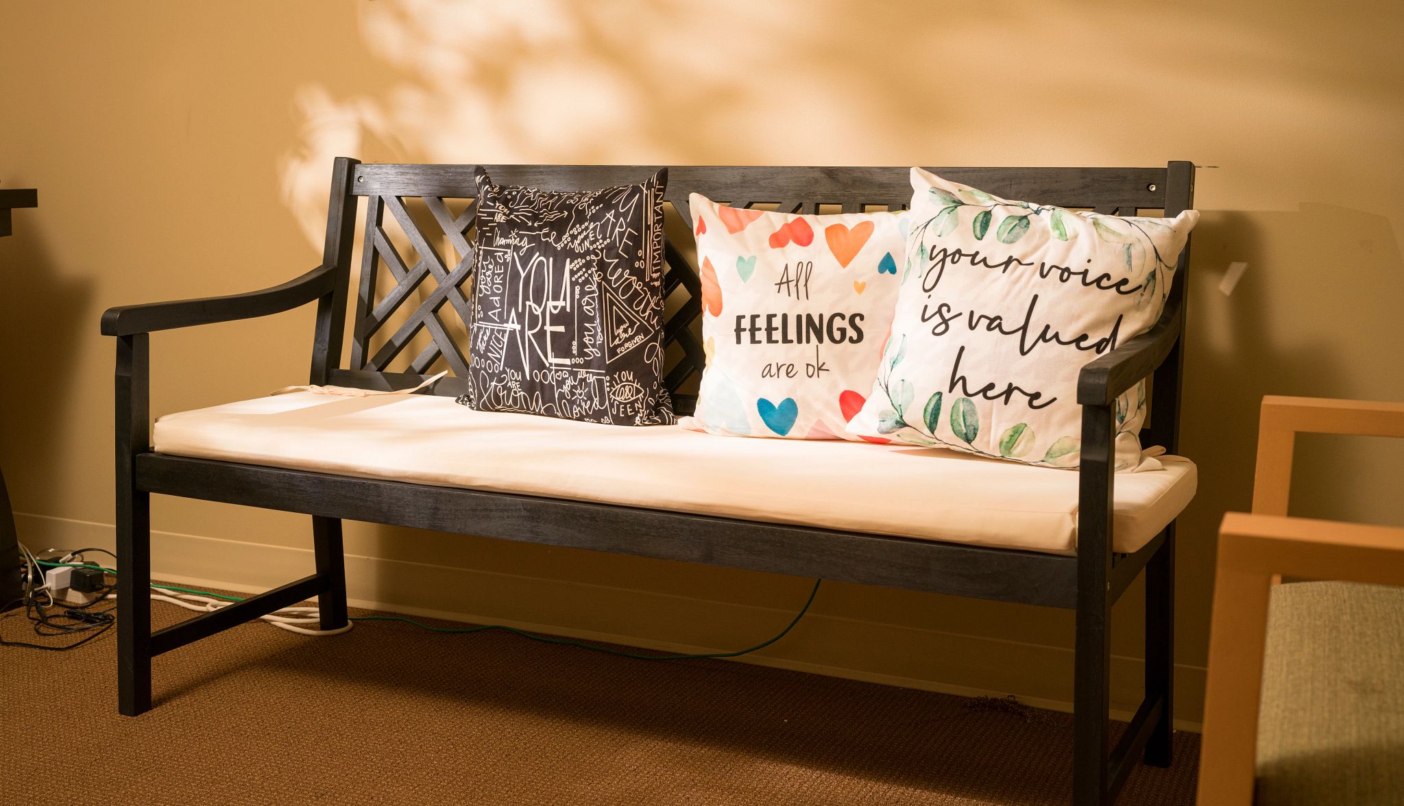 A photo shows the indoor Friendship Bench at the senior center in Washington, D.C., where Angela Jasper and Robin Baxter often meet.