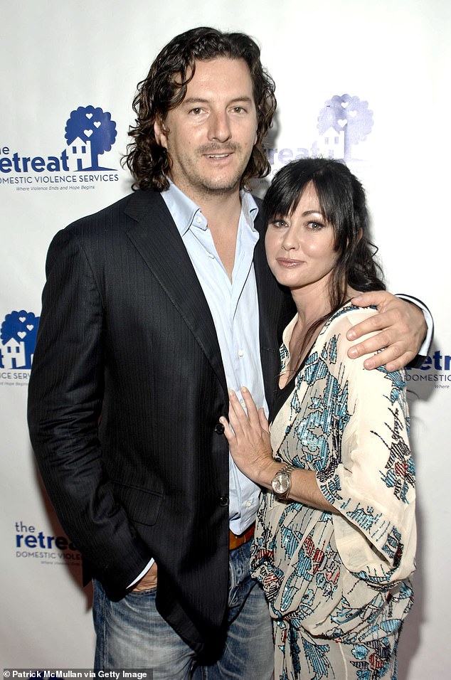 Doherty recently admitted that her divorce and cancer journey was 'really hard' for her over the past year. Pictured: her ex-husband Kurt Iswarienko in 2010