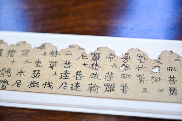 The world’s oldest printed object – a 1250-year-old print of Buddhist prayers – at the Melbourne Rare Book Fair.