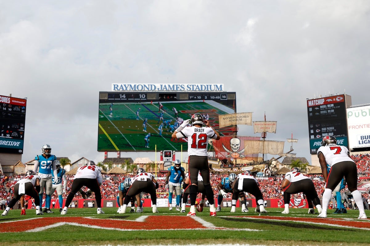 TAMPA, FLORIDA - JANUARY 01: Tom Brady #12 of the Tampa Bay Buccaneers signals at the line of scrimmage during the third quarter against the Carolina Panthers at Raymond James Stadium on January 01, 2023 in Tampa, Florida. (Photo by Mike Ehrmann/Getty Images)