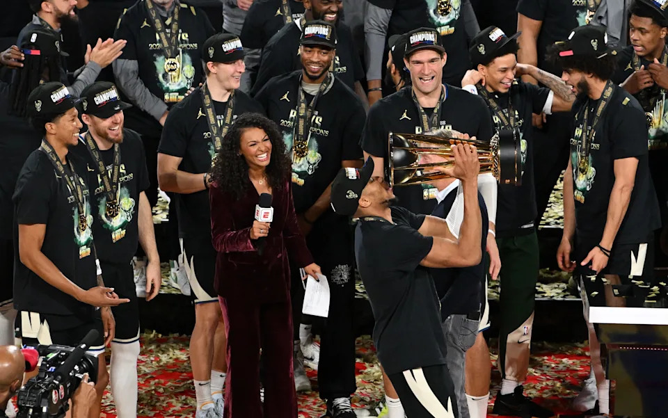 Dec 17, 2024; Las Vegas, Nevada, USA; Milwaukee Bucks forward Giannis Antetokounmpo (34) celebrates with the trophy, other players and staff after winning the Emirates NBA Cup championship game against the Oklahoma City Thunder at T-Mobile Arena. Mandatory Credit: Candice Ward-Imagn Images