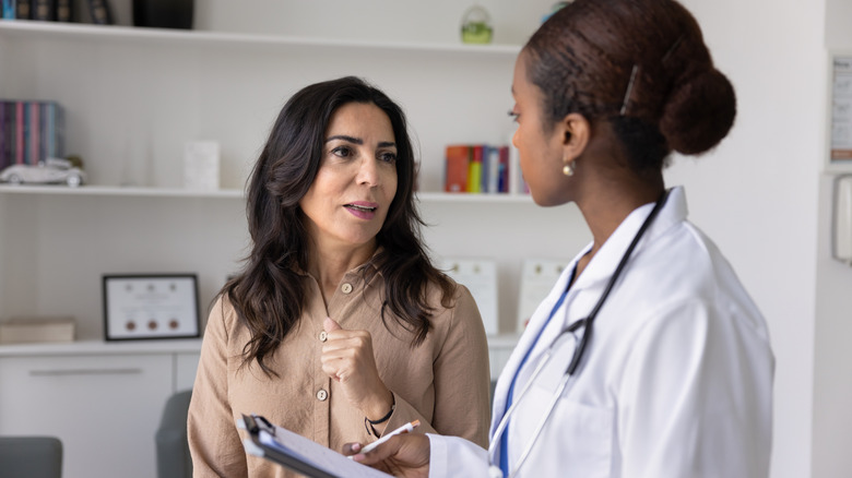 A woman talking to her doctor