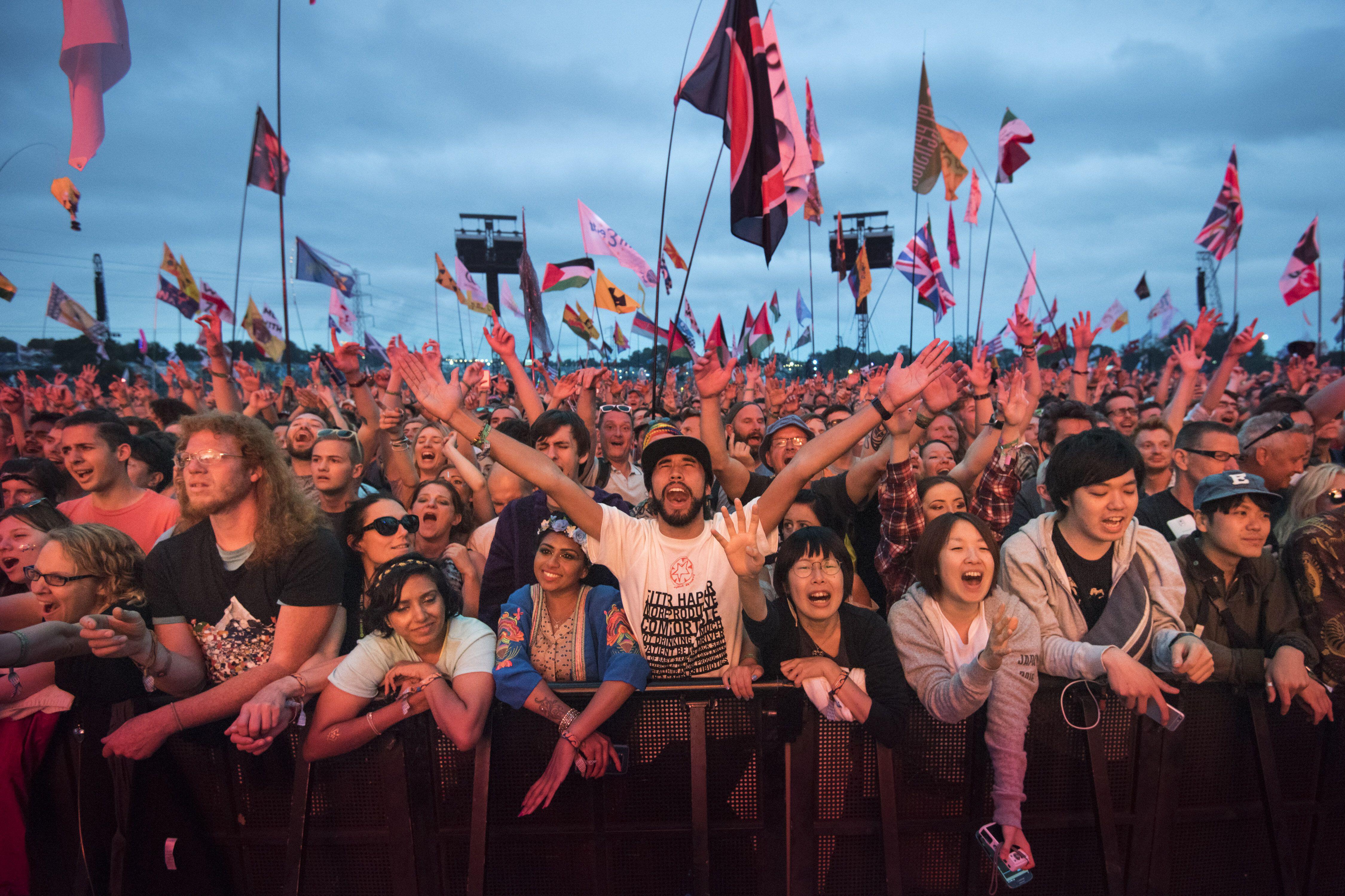 Large crowd at Glastonbury Festival watching Radiohead perform.