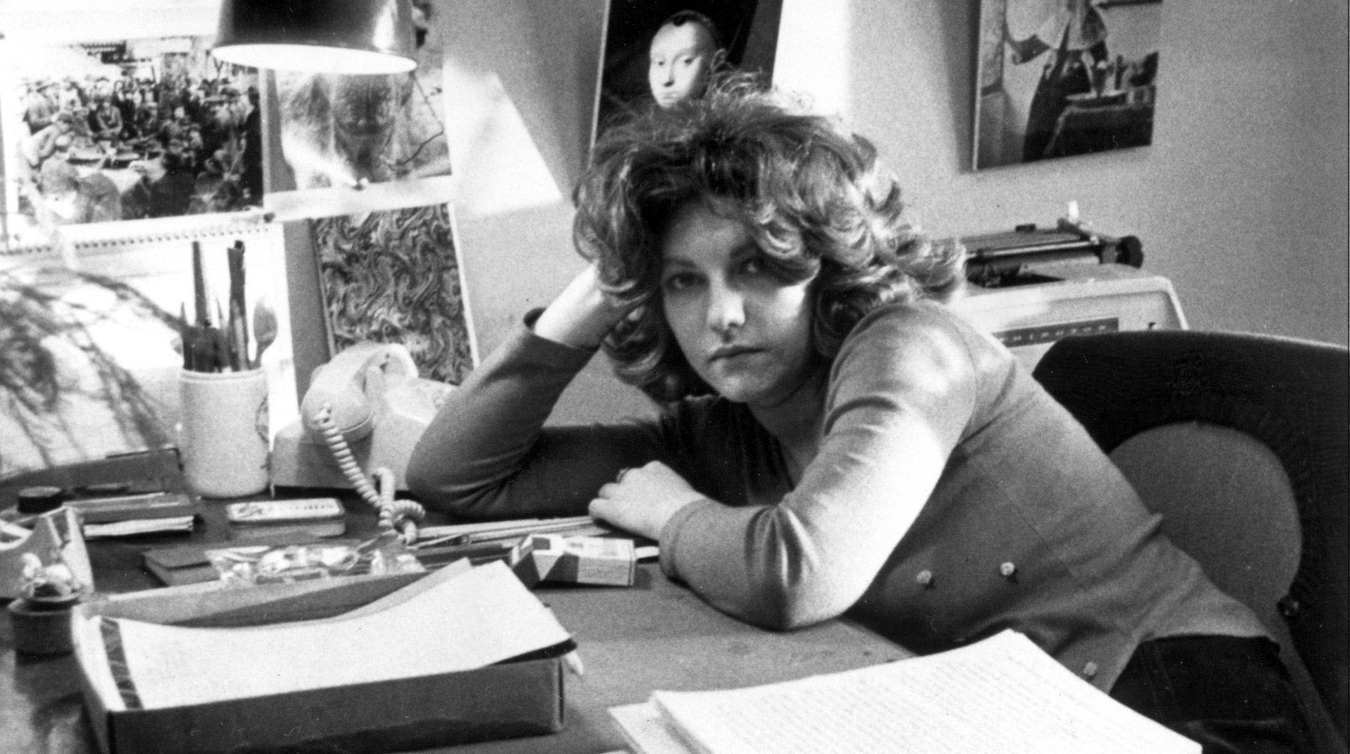 Photo of Laurie Colwin at her desk.