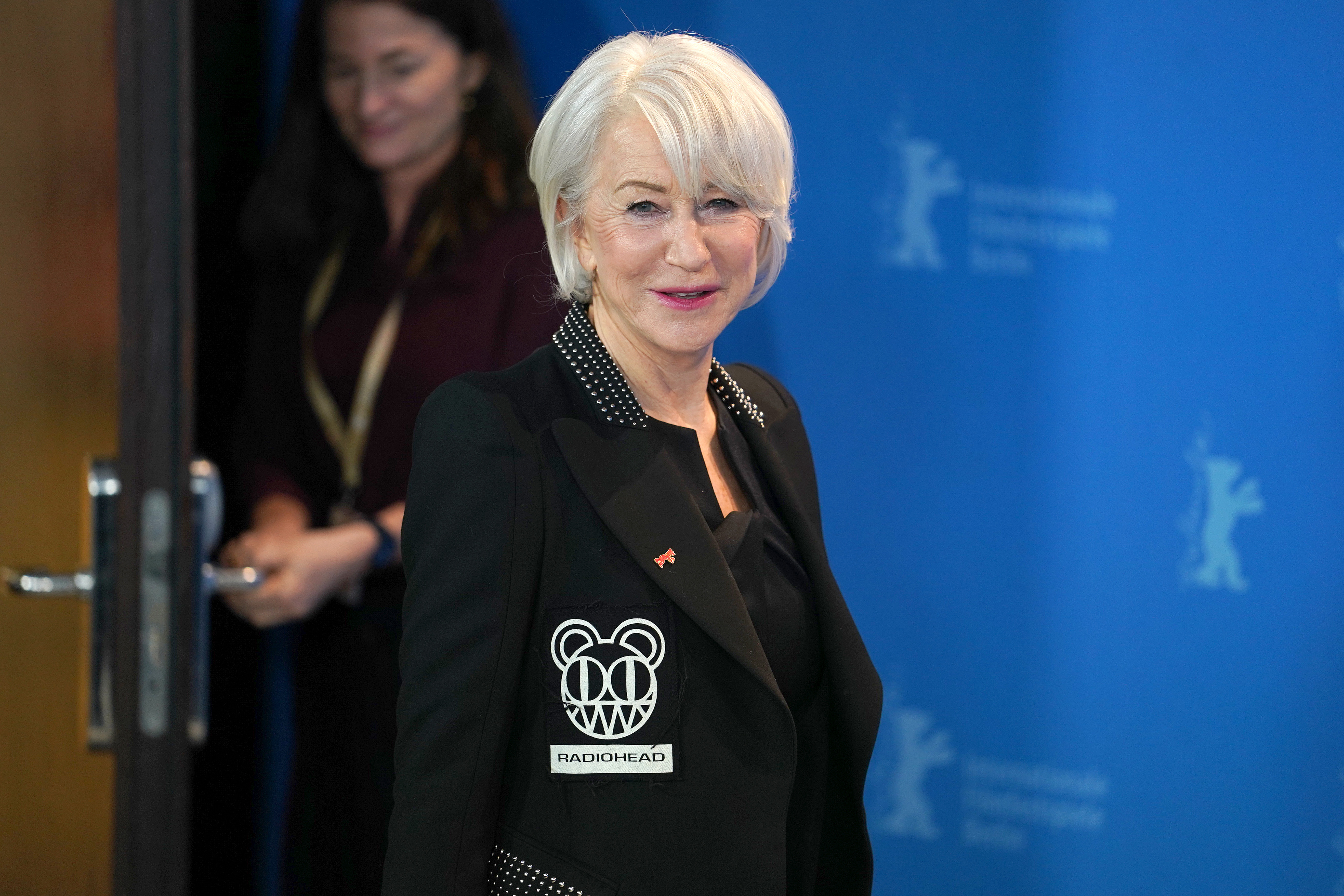 Helen Mirren at the Berlinale Film Festival wearing a Radiohead patch.