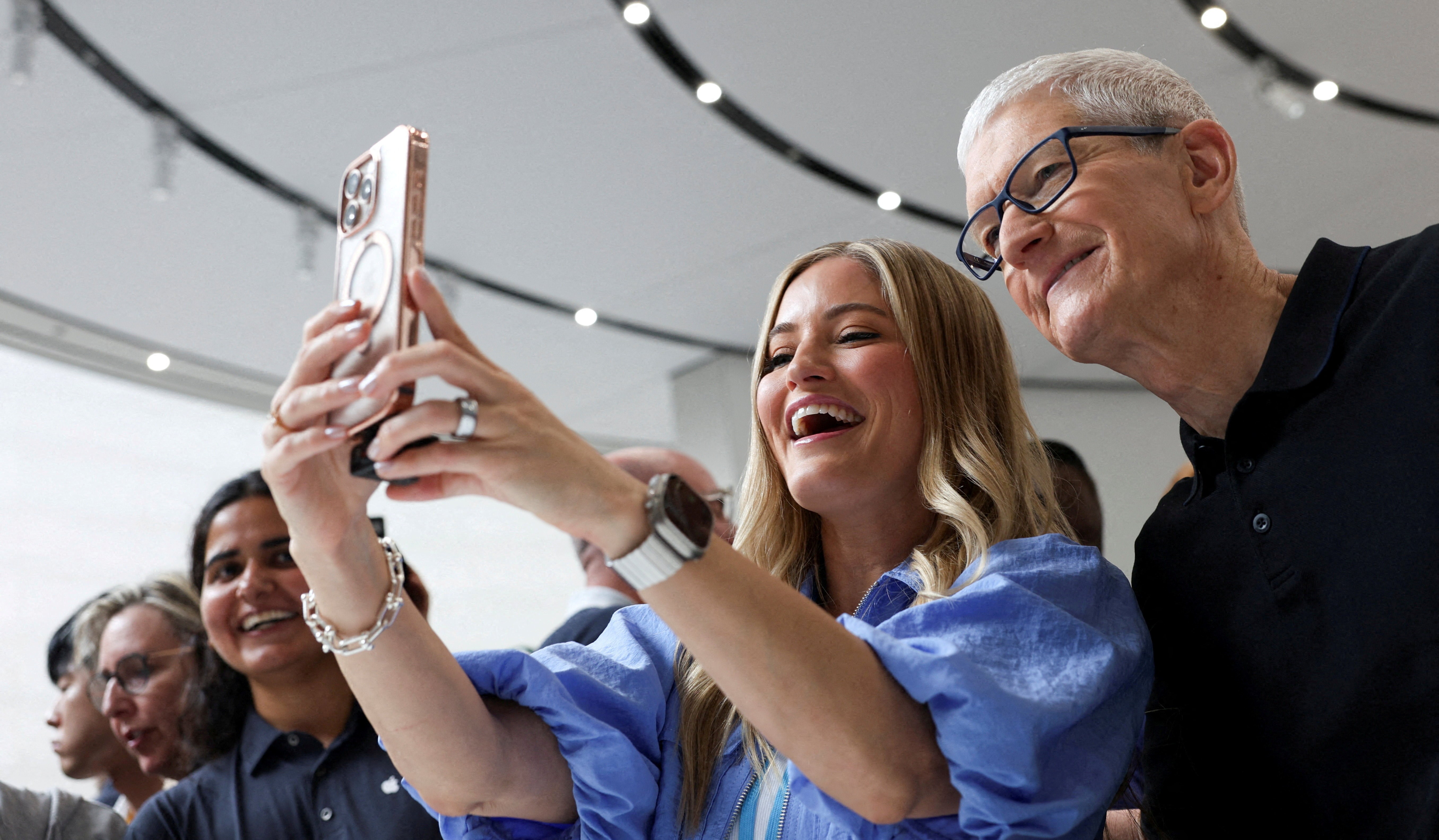 Tim Cook and YouTuber iJustine taking a selfie.
