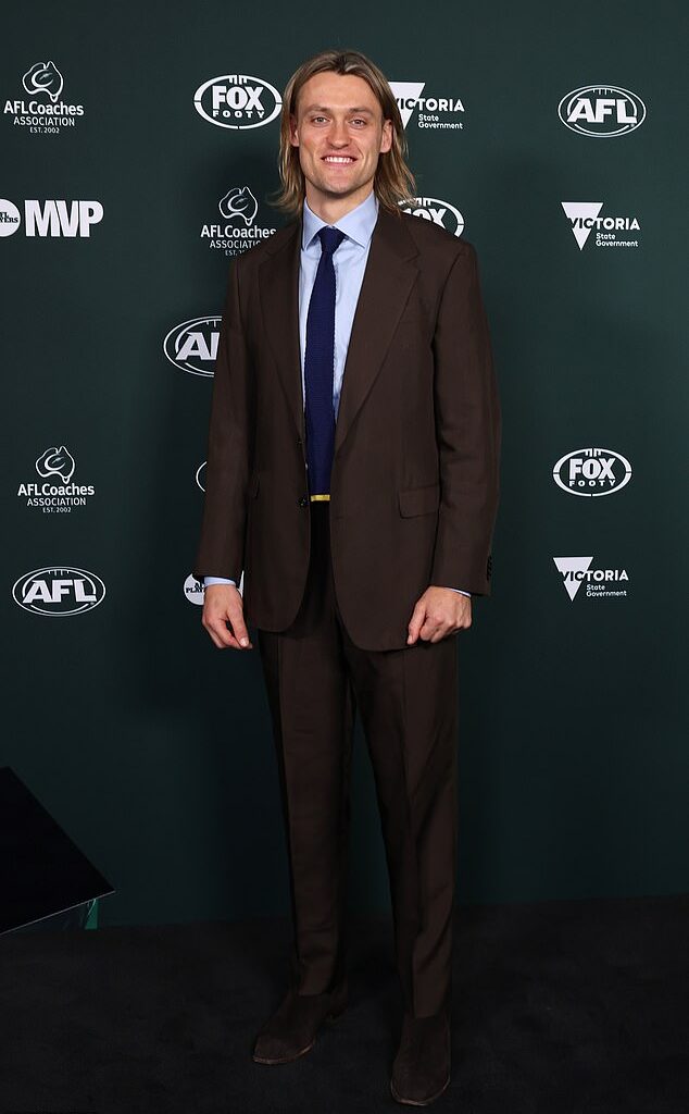 AFL star Darcy Moore has sent fans wild over a simple seven-word comment on a post shared by partner Dee Salmin