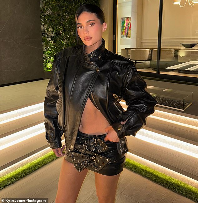 Kylie Jenner, 28, showed off her fit figure while sporting a skimpy leather look in a new Instagram post shared on Saturday