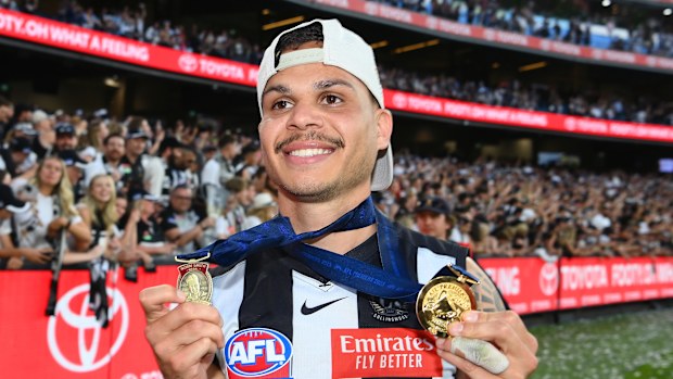 Bobby Hill of the Magpies celebrates winning the Norm Smith Medal in 2023.