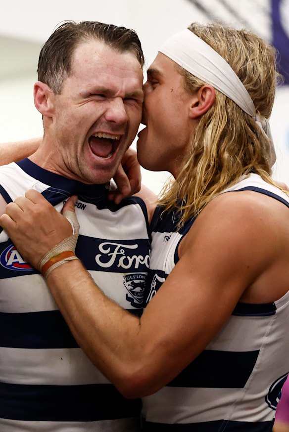 Smith celebrates Geelong’s preliminary final win with skipper Patrick Dangerfield.