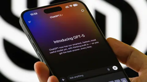 Getty Images Close up of someone holding a smartphone showing the introduction to ChatGPT