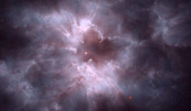 Glowing balls of purplish whitish gas are seen in the darkness of space around a white dwarf cocoon