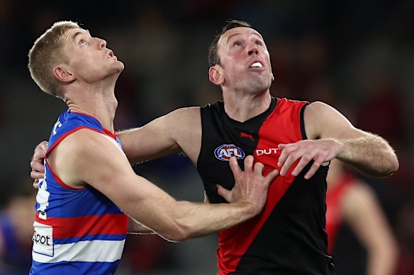 Todd Goldstein competes in a ruck contest with Tim English.