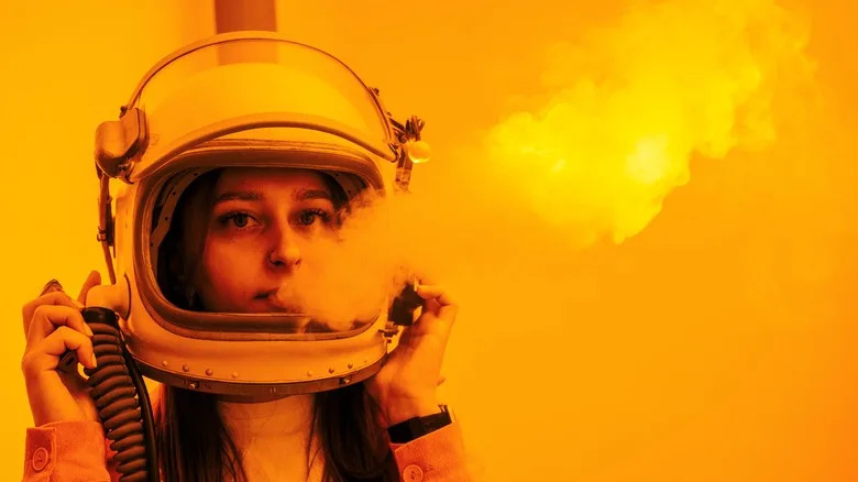 Astronaut with smoke coming from mouth