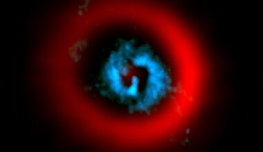 ALMA image of the dust ring (red) and gaseous spirals (blue) of the circumstellar disk AB Aurigae reveal gaseous spiral arms inside a wide dust gap, providing a hint of planet formation (Credit : ALMA)