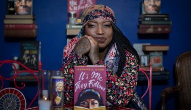Author Jeannine Cook poses with her book on Monday, Sept. 15, 2025, at the newly refurbished Harriett's Bookshop in Philadelphia.