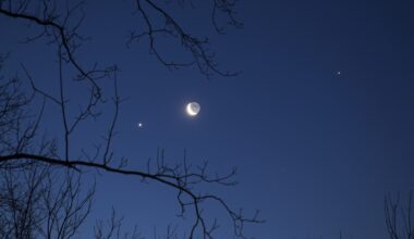 A photo of a crescent moon with brightly shining planets and stars