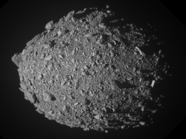 Greyscale image of a rocky asteroid