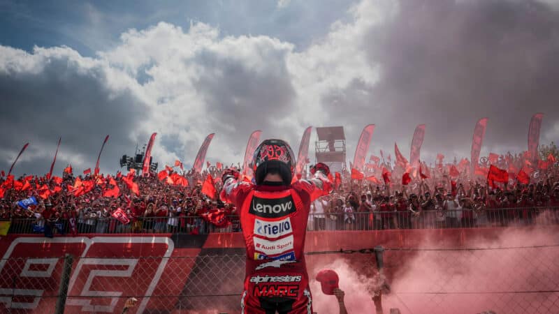 Marc Marquez celebrates second place at 2025 MotoGP Barcelona round in front of crowd of supporters