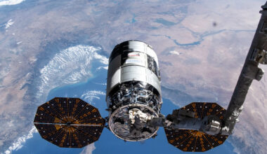 Northrop Grumman&rsquo;s 21st Cygnus cargo craft, with its prominent cymbal-shaped UltraFlex solar arrays, is pictured in the grips of the Canadarm2 robotic arm shortly after its capture on Aug. 6, 2024.