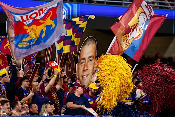 Lions fans celebrate a goal.