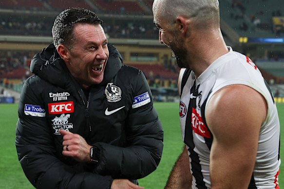 Sidebottom and coach Craig McRae (left) share a laugh part-way through their 2023 premiership season.