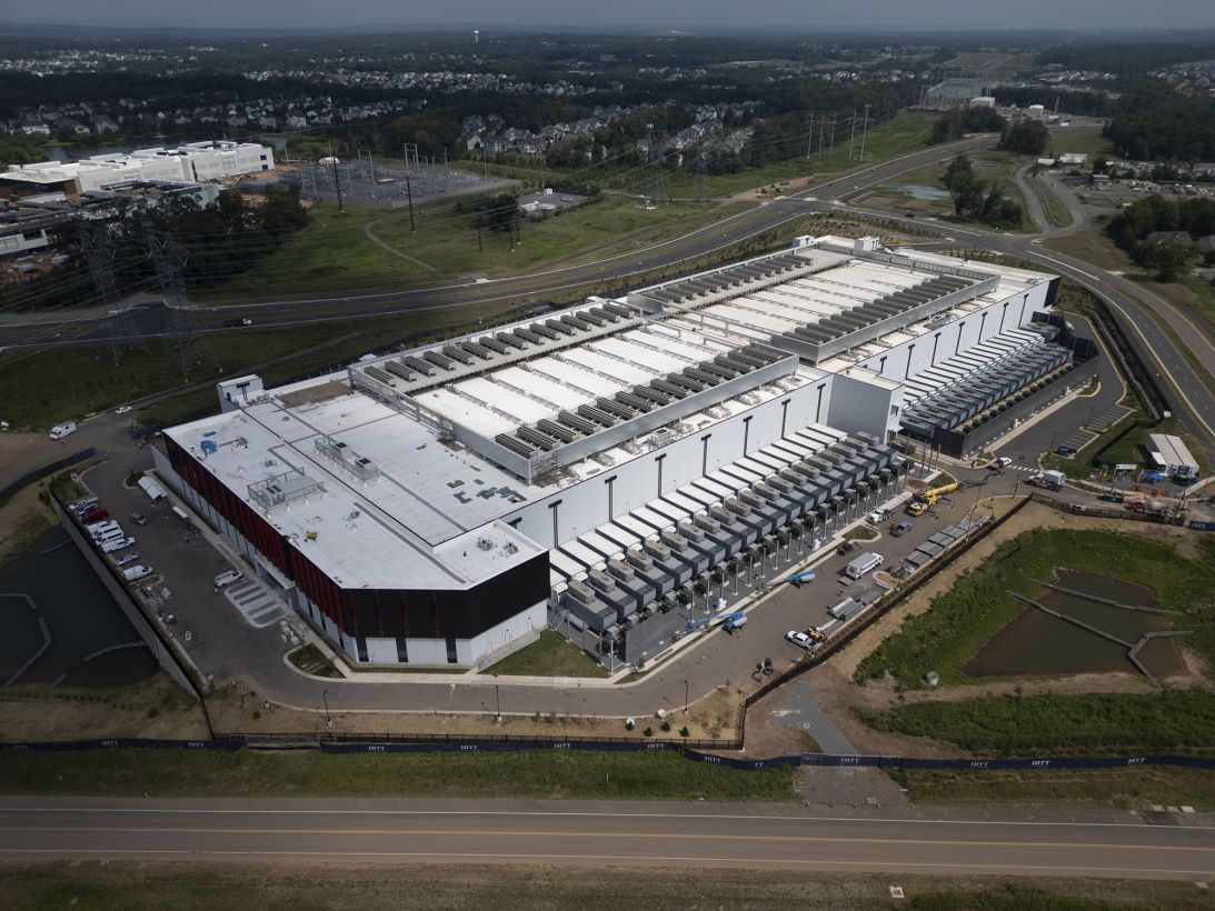 A data center in Ashburn, Virginia, is pictured on July 25. Northern Virginia housing developments that will soon be walled in by data centers exemplify the tensions over unfettered growth, as calls increase for regulation.