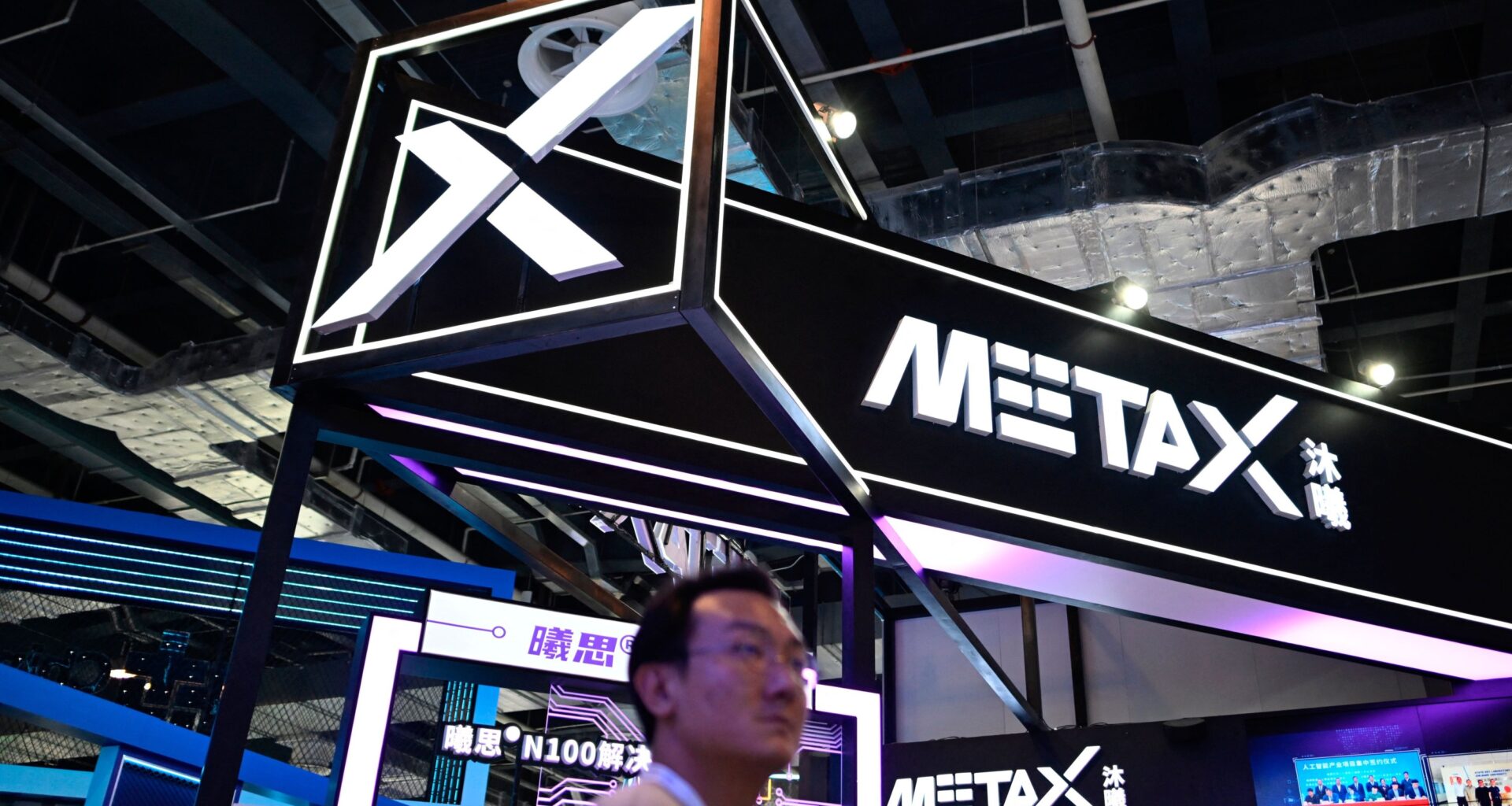 People visit the booth of MetaX during World Artificial Intelligence Conference (WAIC) in Shanghai on July 6, 2023.