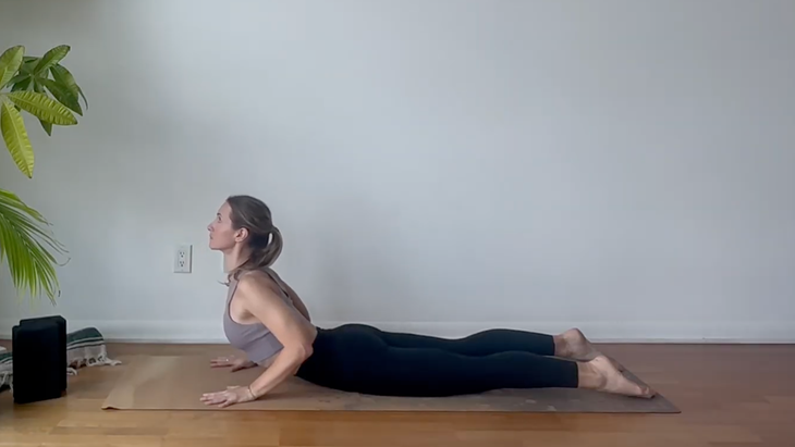 Yoga teacher Julia Eskins practicing yoga for mobility in Baby Cobra Pose