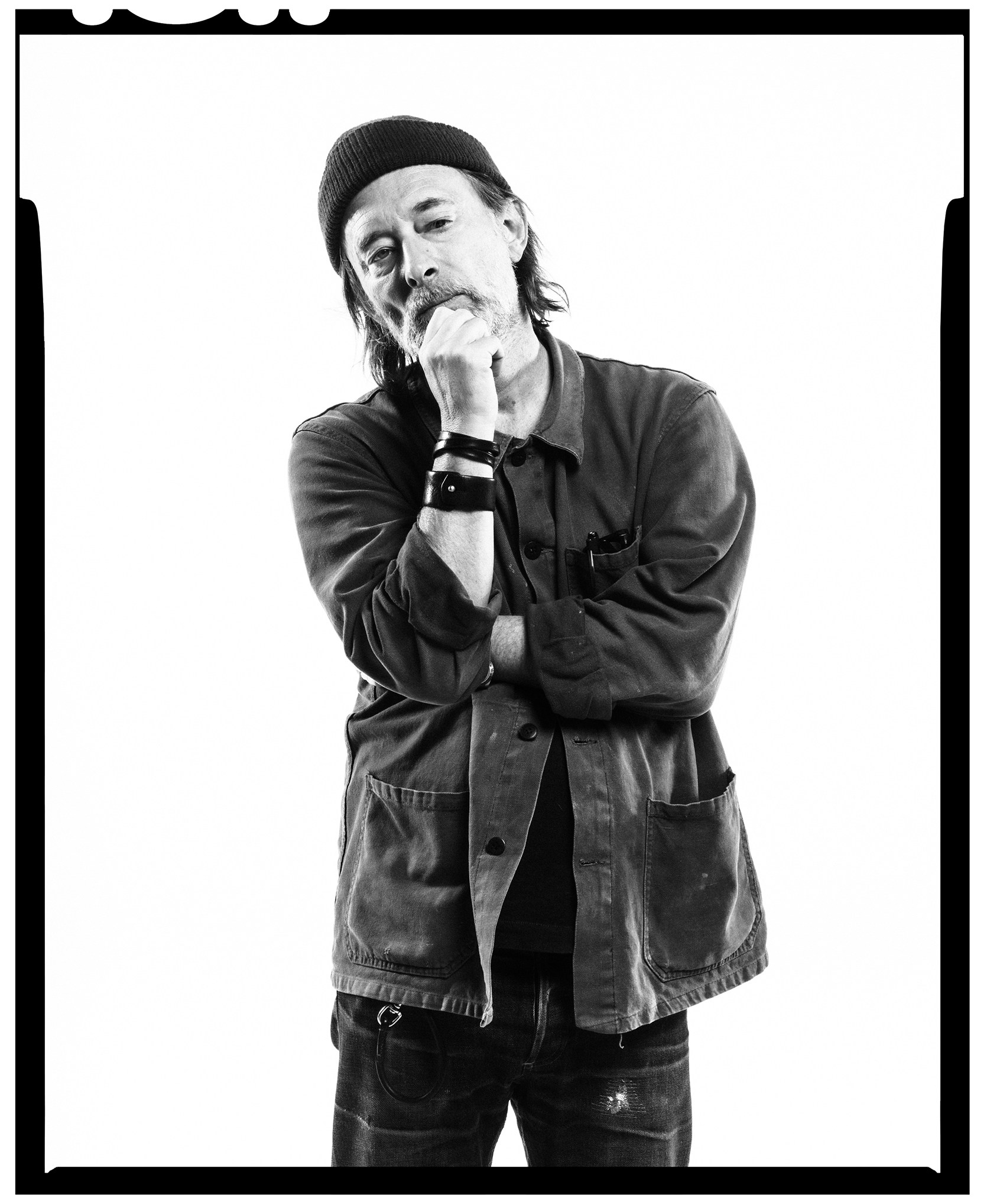 Black and white photo of Radiohead band member Thom Yorke looking thoughtful.