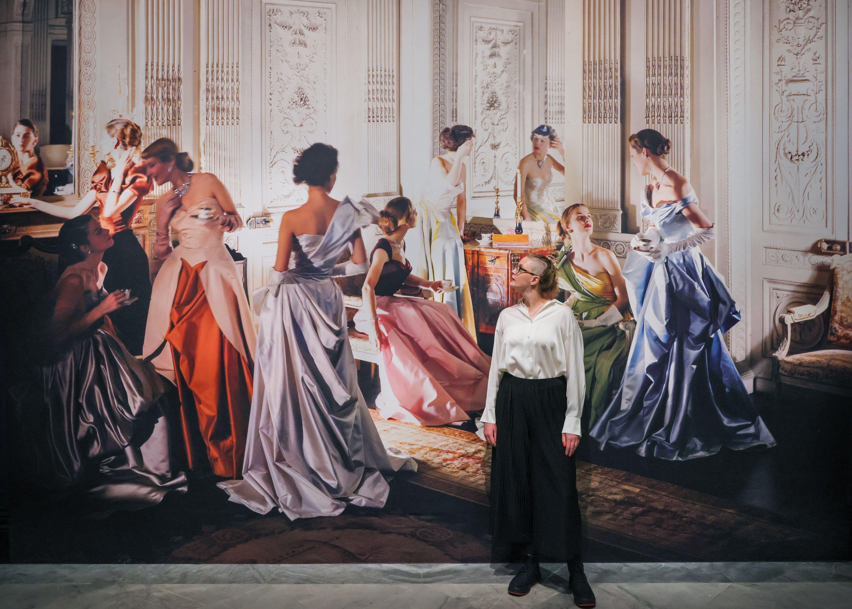 London, UK. 08th Oct 2025. Gallery staff with Cecil Beaton, Worldly Colour (Charles James evening dresses), 1948. Cecil Beaton?s Fashionable World opens on 9th October at the National Portrait Gallery and runs until 11th January 2026.