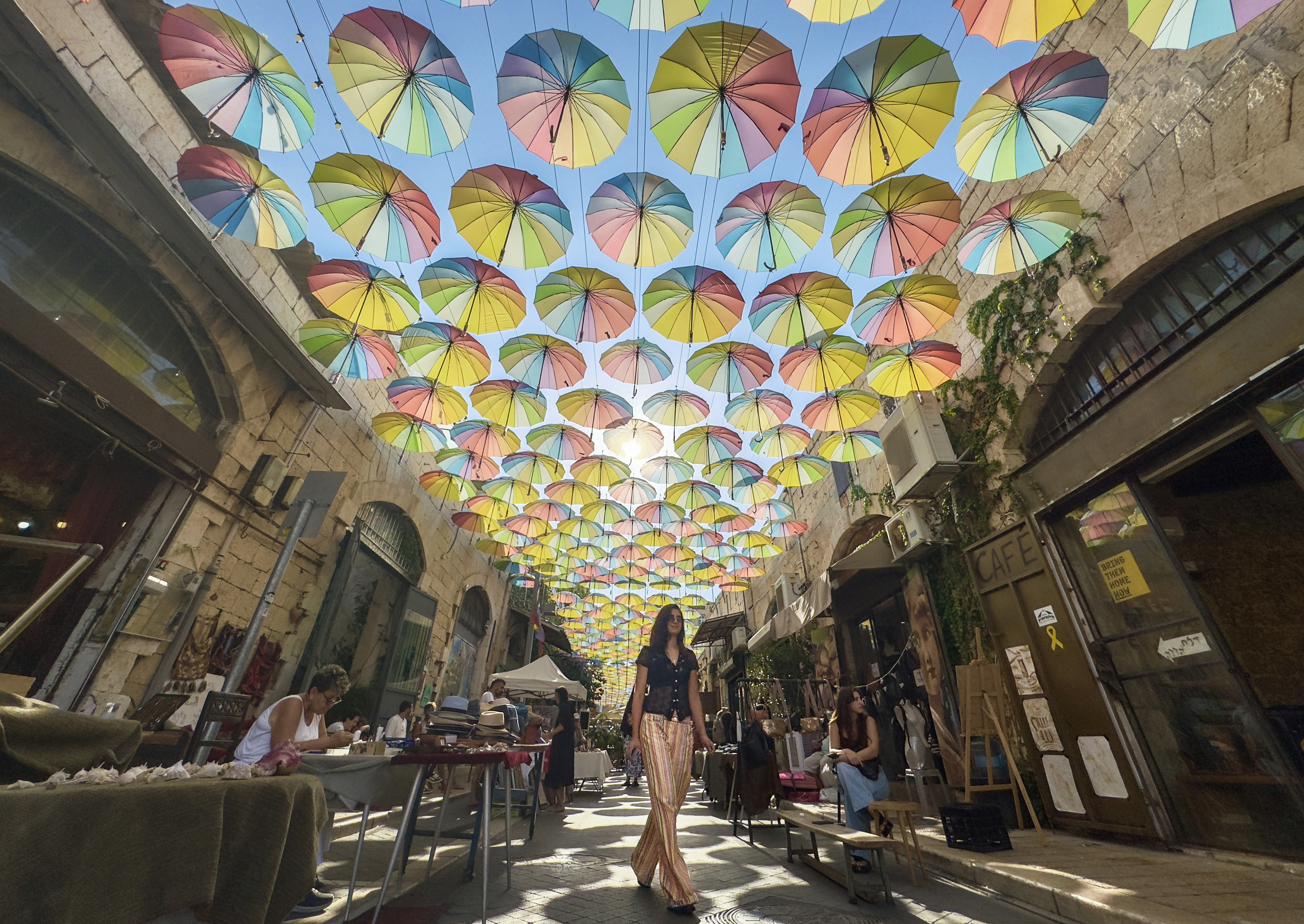 Yoel Moshe Solomon Street in Jaffa (Yafo) is a popular tourist and art spot known for its vibrant, festive atmosphere and art installations. Mourners were asked to wear pink as that was her tag name apparently. Tel Aviv.