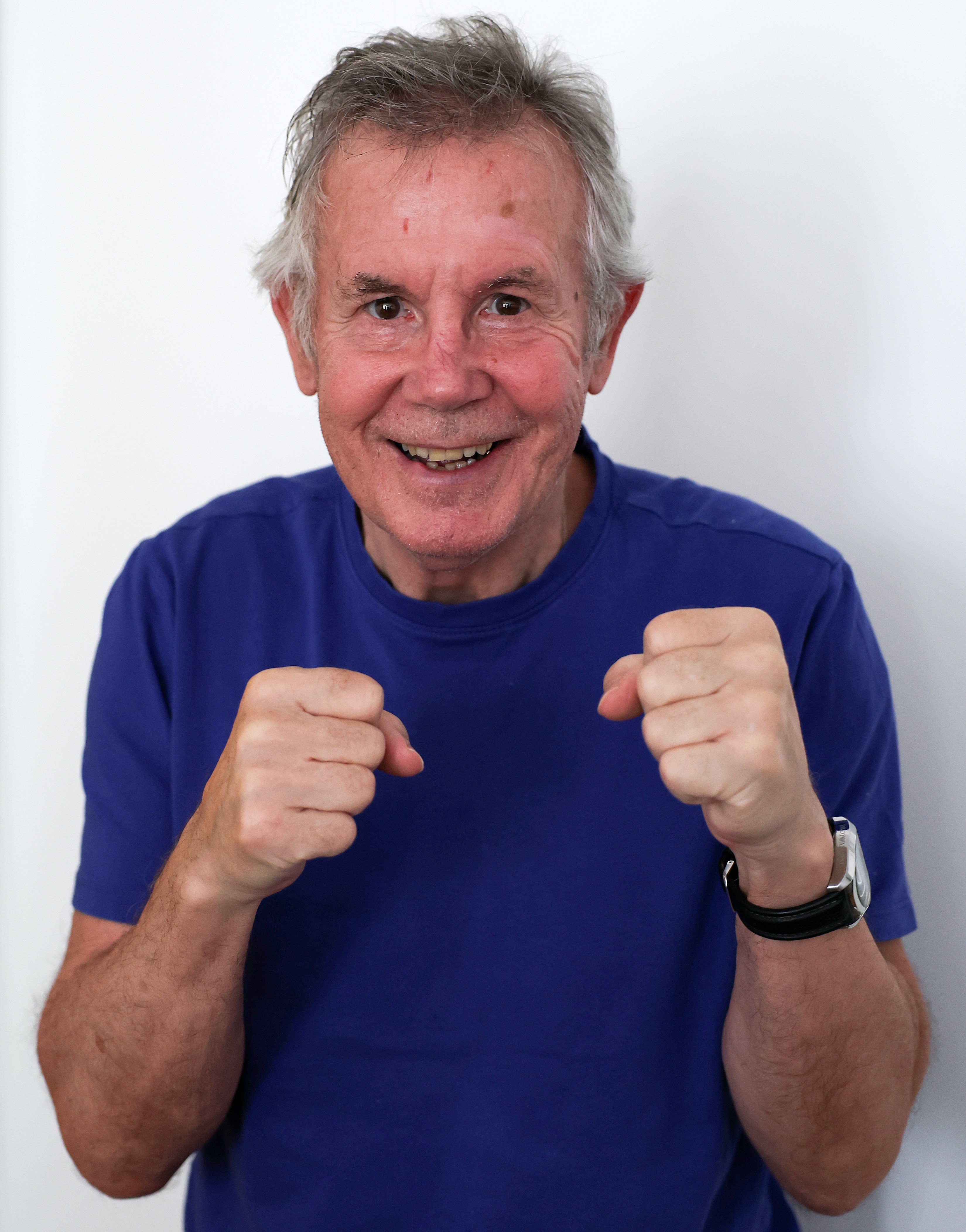 Jimmy Batten, former boxer, posing with fists raised.