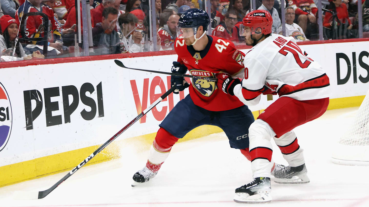 Ottawa Senators defenseman Jake Sanderson (85) and New Jersey Devils center Nico Hischier (13)